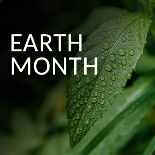 Close-up of a green leaf with water droplets, set against a dark background. The words 